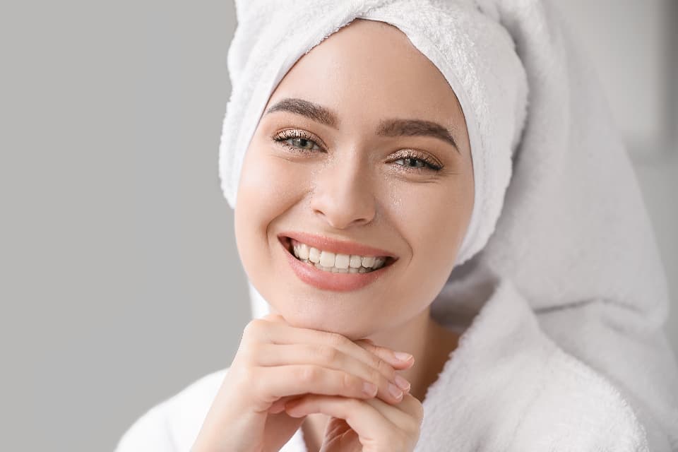 A woman smiling with bright teeth